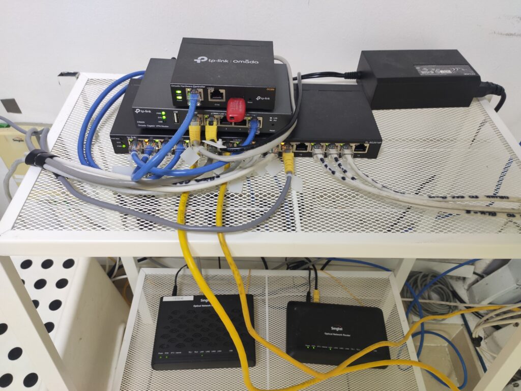Managed network rack with an Omada controller, router and PoE switch, neatly cabled